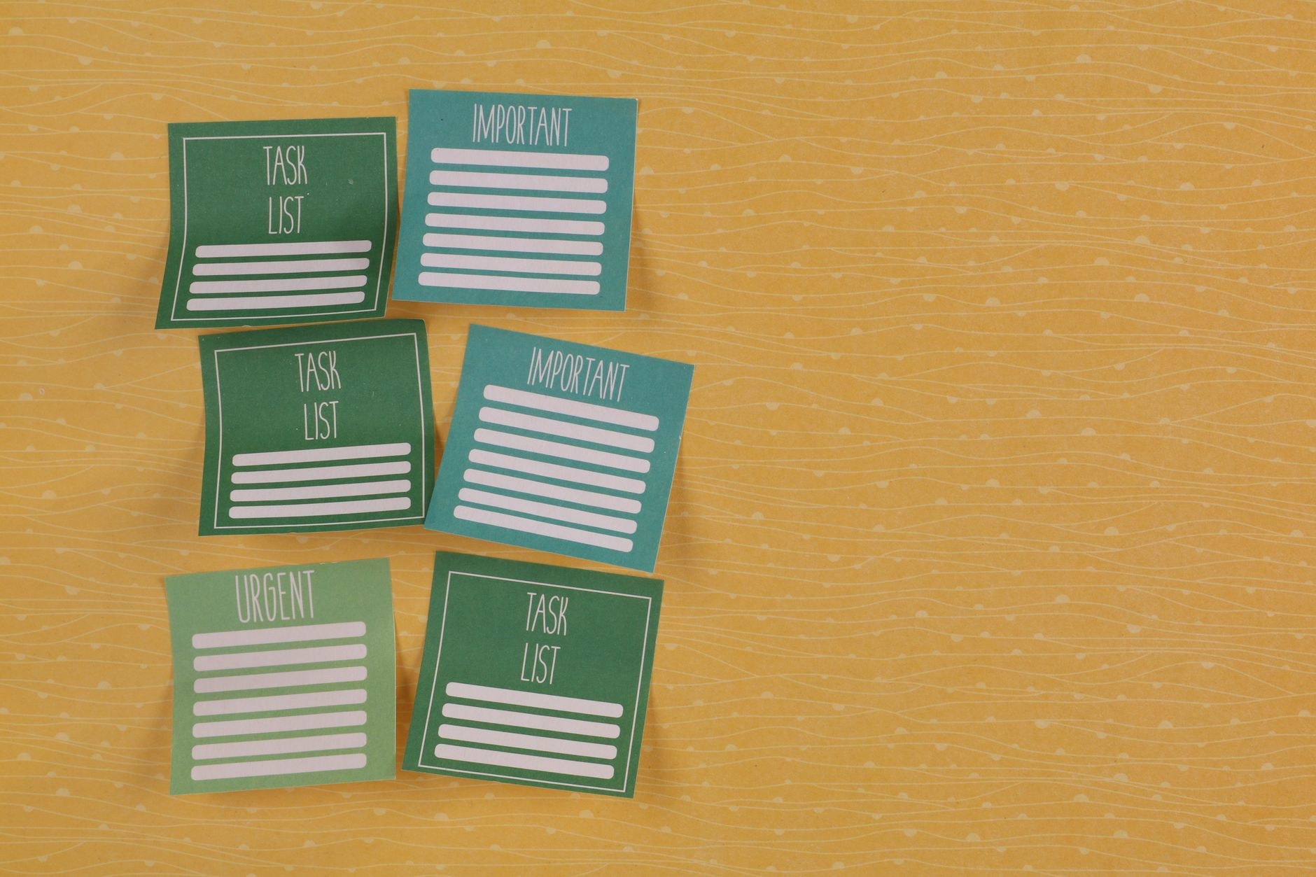 Close-up of colorful sticky notes on yellow background with task-related labels.